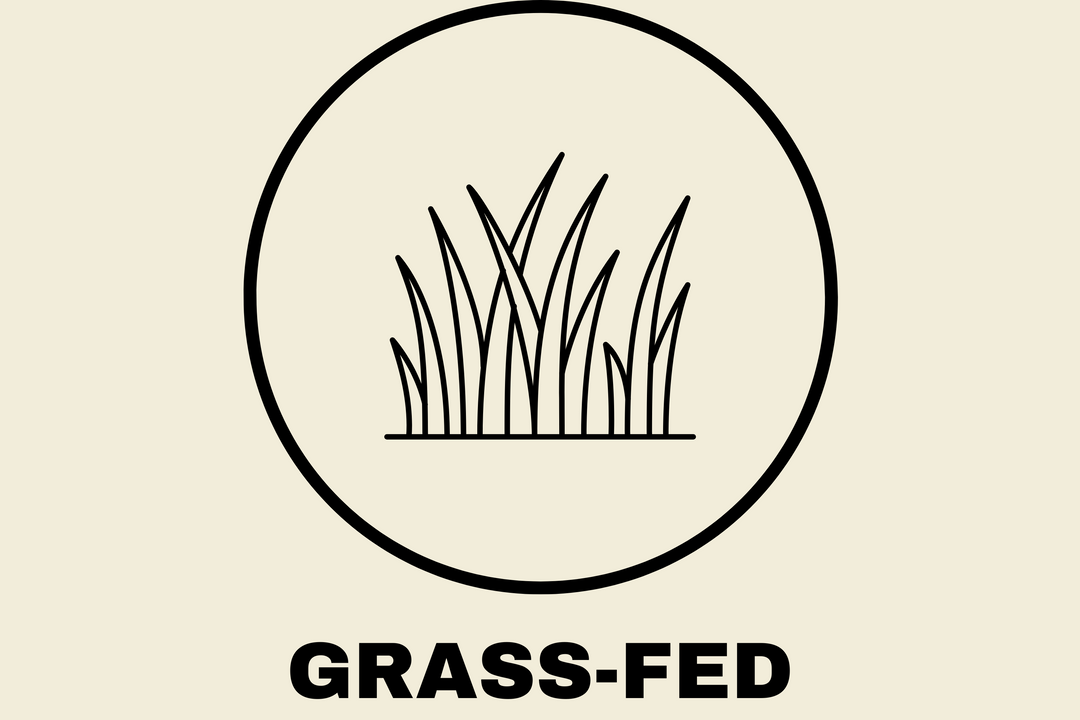 Circle icon with grass illustration and text below reading 'Grass-Fed,' representing Earth & Tail's use of pasture-raised ingredients.